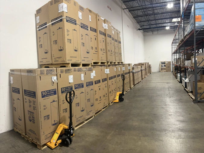 Water heaters stacked in the Cowan Supply Forest Park plumbing warehouse